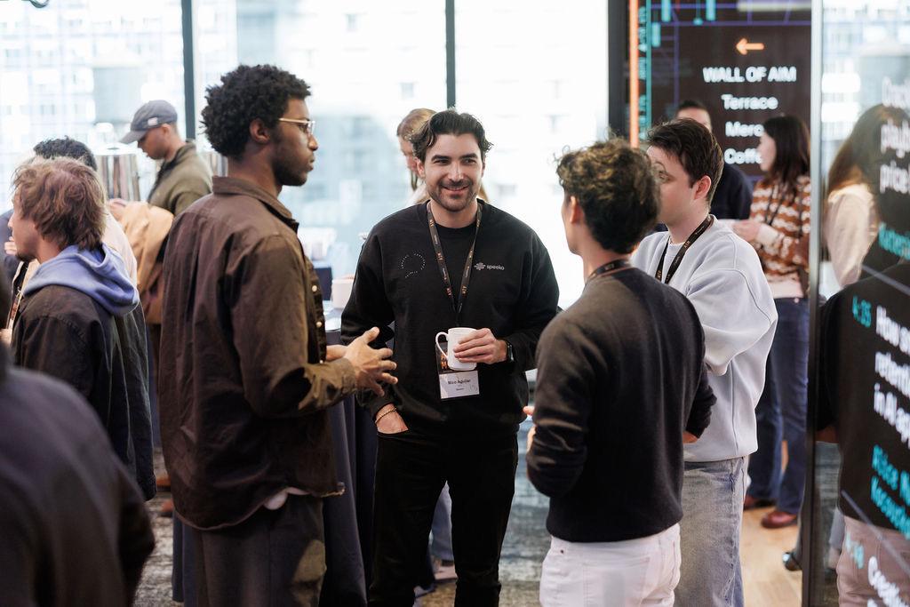 Attendees in conversation during an AIM Conference networking break