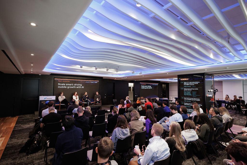 A panel discussion on stage at the AIM Conference
